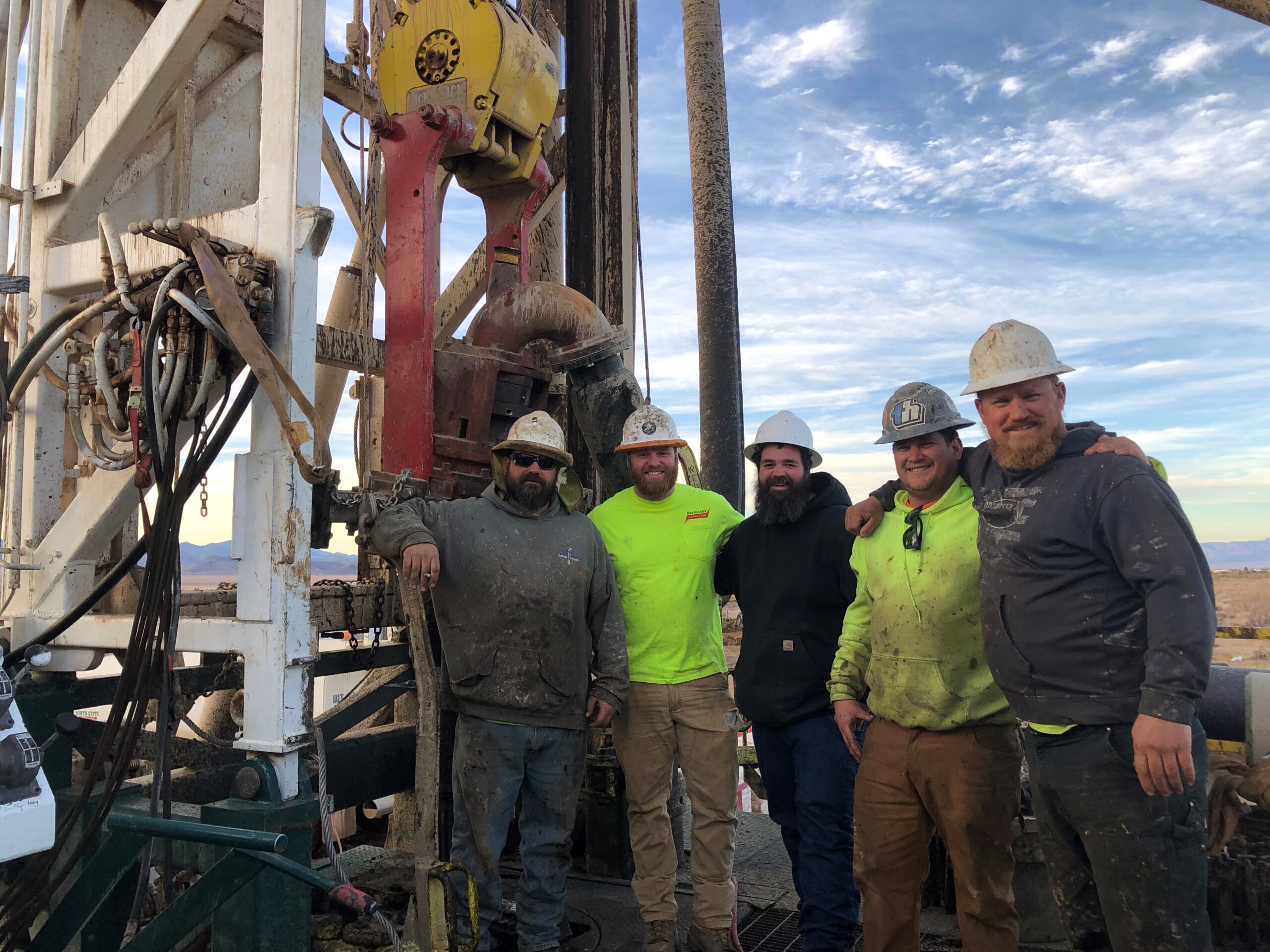 Large drilling rig drilling a water well, with North State Drilling workers present. Chico & North State well drilling pump & electric